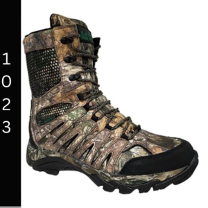 A pair of boots that are in the woods.