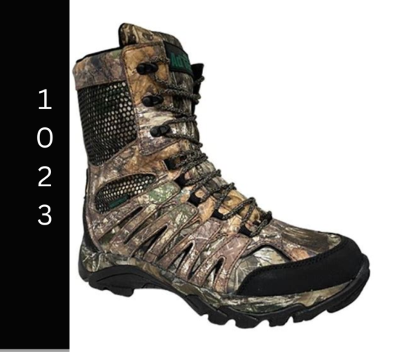 A pair of boots that are in the woods.