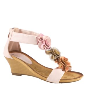 A pair of pink sandals with flowers on them.