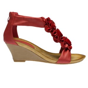 A red wedge sandal with ruffles on the side.