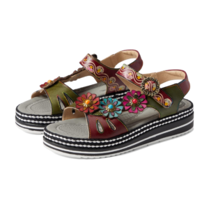 A pair of sandals with flowers on them.