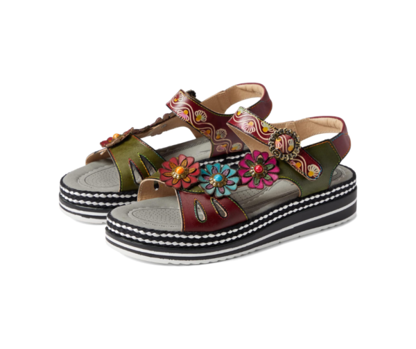 A pair of sandals with flowers on them.