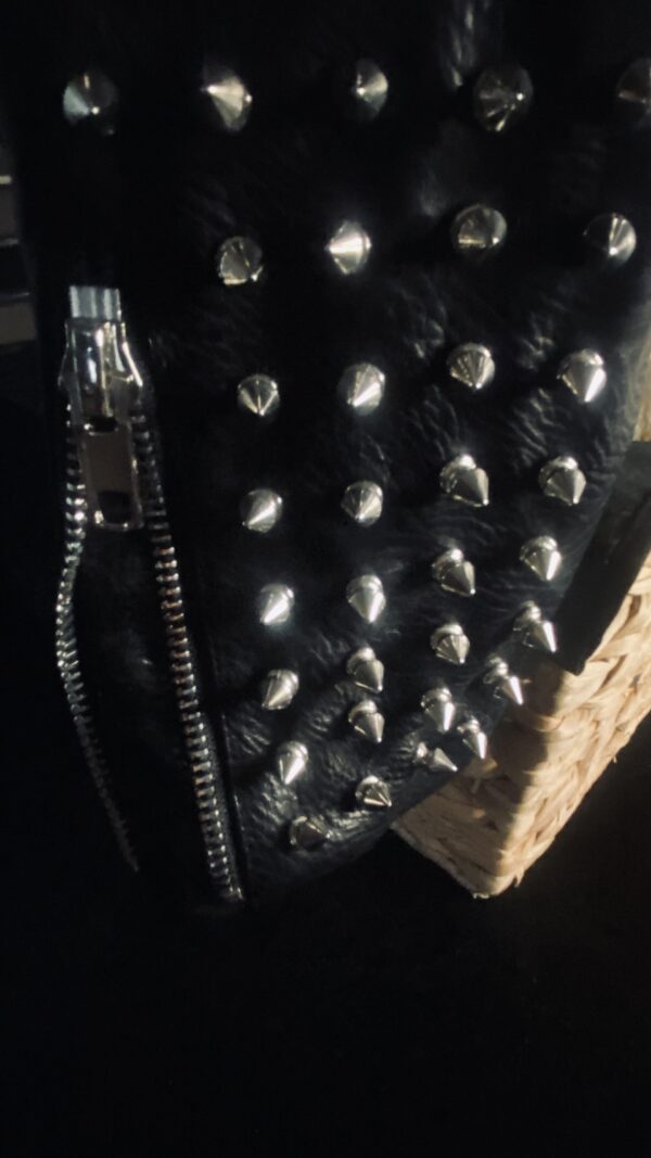 A close up of some metal spikes on a bag