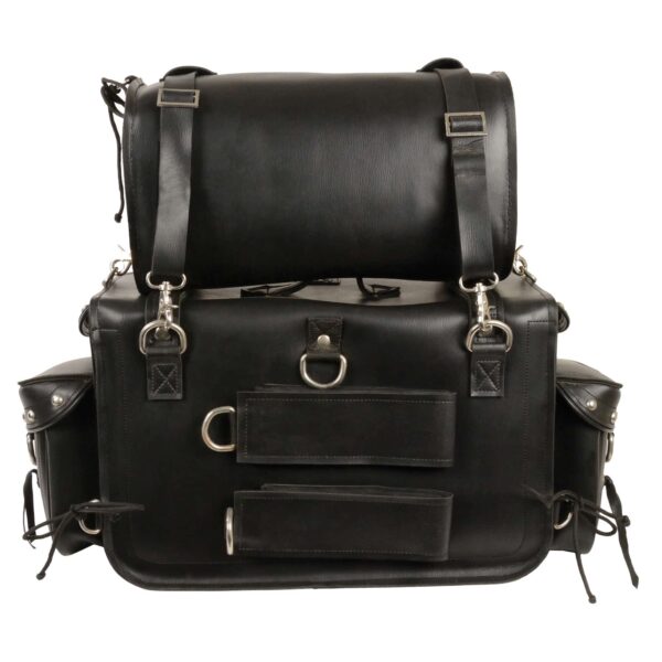 A black leather bag with two bags on top of it.