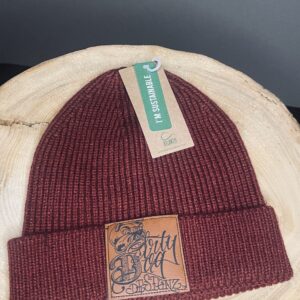 A red beanie with a patch on it's side.