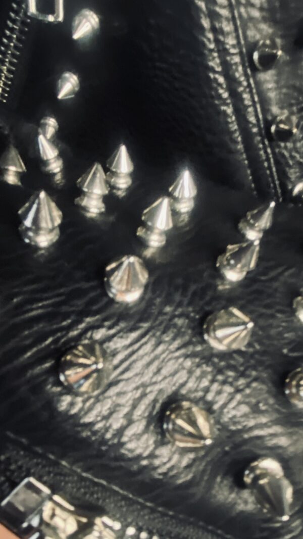 A close up of many metal spikes on the ground