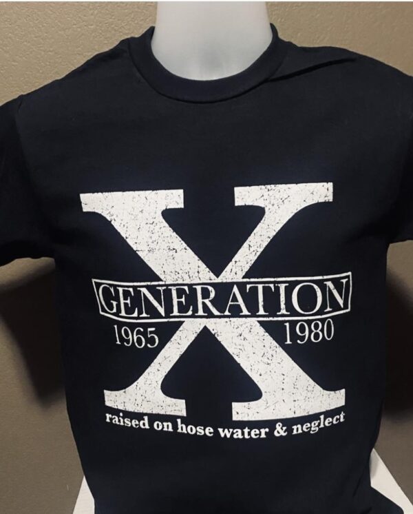 A black shirt with the words " generation x 1 9 6 5-1 9 8 0 ".
