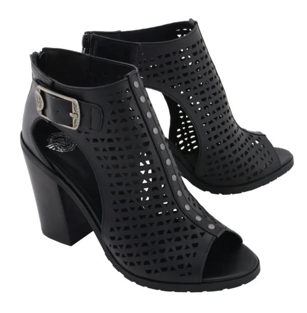 A pair of black shoes with holes and a buckle.
