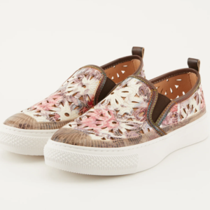A pair of shoes with floral designs on them.