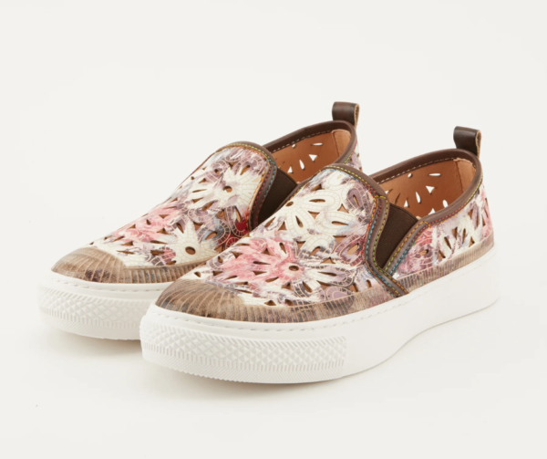 A pair of shoes with floral designs on them.