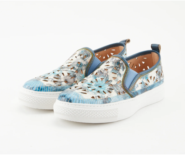 A pair of blue shoes with white soles.