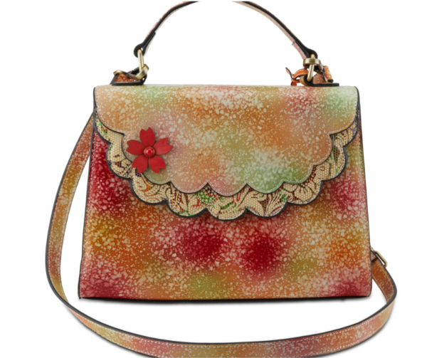 A purse with a flower on the front of it.