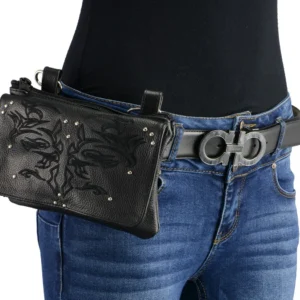 A woman wearing jeans and holding a purse.