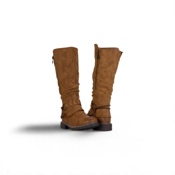 A pair of brown boots on the ground