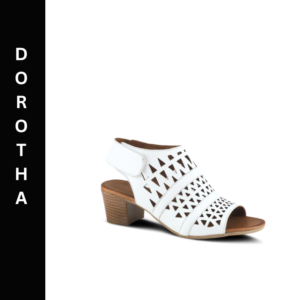 A white shoe with a wooden heel and cut out design.