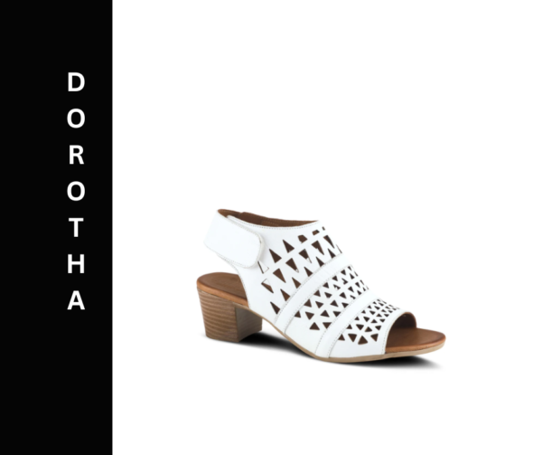 A white shoe with a wooden heel and cut out design.