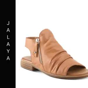 A tan sandal with a side zipper and a black label.