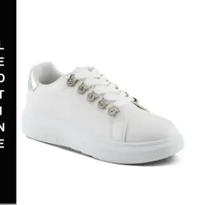 A white sneaker with silver accents on the side.