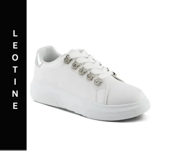 A white sneaker with silver accents on the side.
