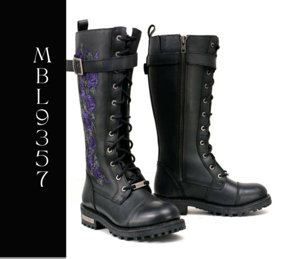 A pair of boots with purple flowers on them.