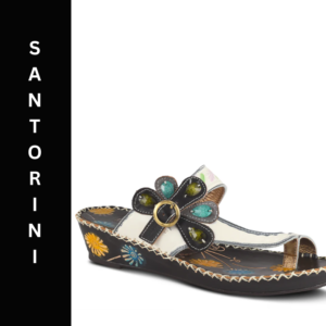 A pair of sandals with a flower on the side.