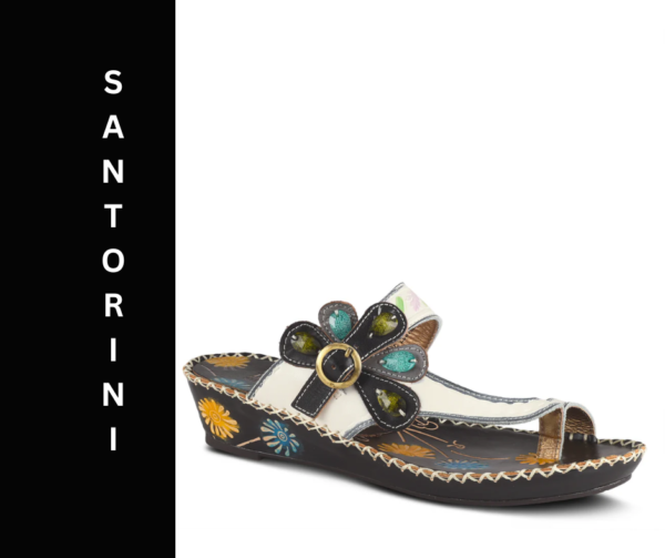 A pair of sandals with a flower on the side.