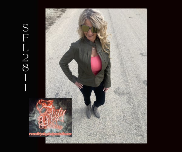 A woman standing on the side of a road.