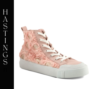 A pink sneaker with flowers on the side.